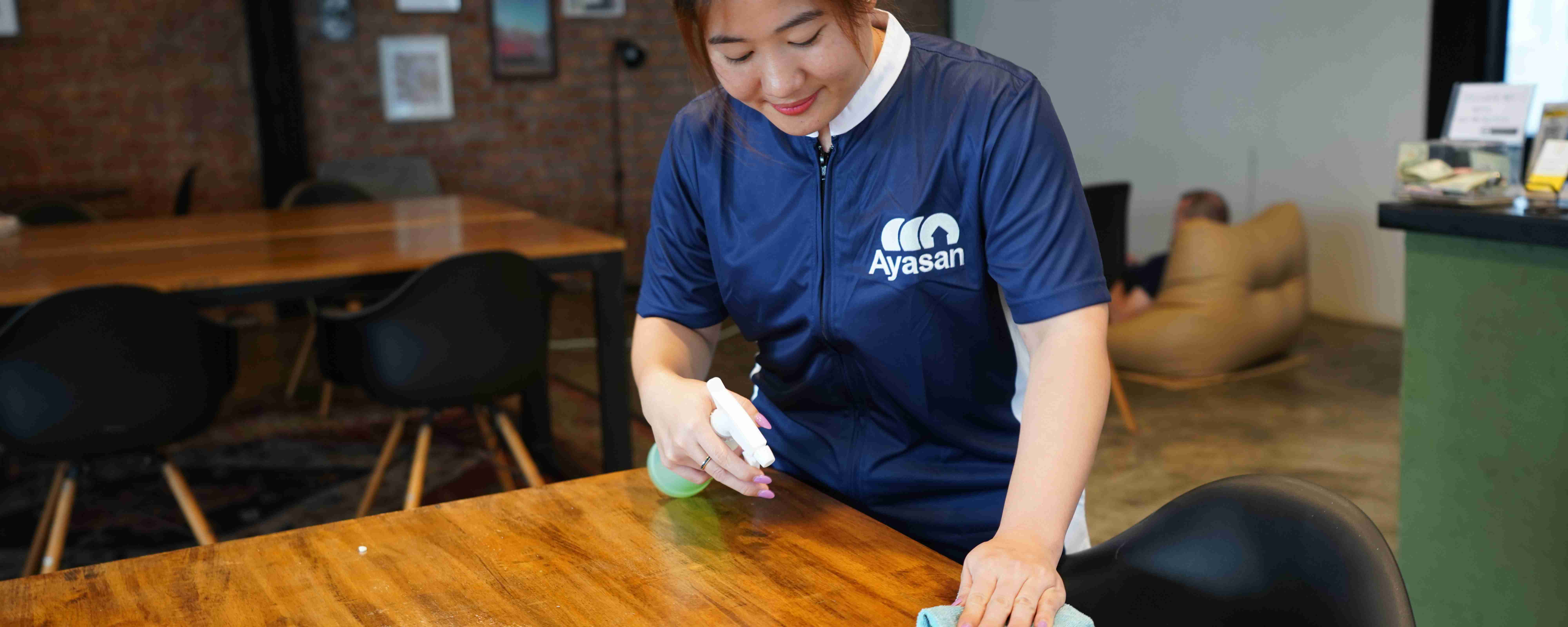 Ayasan staff cleaning a restaurant table